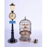 A CONTEMPORARY BIRD CAGE CLOCK together with a lamp post clock & ball clock. Largest 21 cm high. (3)
