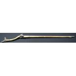 AN ANTIQUE MIDDLE EASTERN BRASS OVERLAID LONG BARREL RIFLE. 143 cm long.