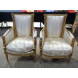 A PAIR OF 19TH CENTURY FRENCH STYLE GILTWOOD UPHOLSTERED SALON CHAIRS overlaid with acanthus capped