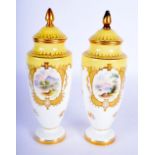 A PAIR OF COALPORT PORCELAIN VASES by P Simpson, painted with landscapes. 18 cm high.