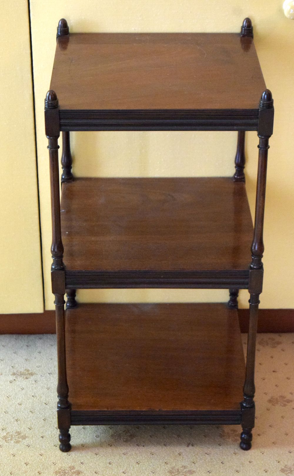 AN ANTIQUE MAHOGANY THREE TIER WHAT NOT of small proportions. 80 cm x 40 cm.