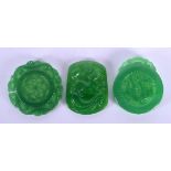 THREE CHINESE CARVED SPINACH JADE PLAQUES 20th Century. 4.5 cm x 4.5 cm. (3)