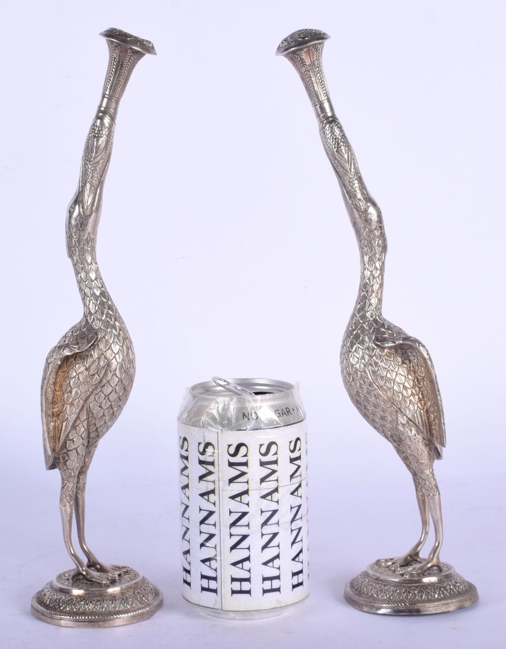 A RARE PAIR OF 19TH CENTURY INDIAN SILVER ROSEWATER SPRINKLERS modelled as birds holding aloft flora