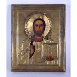 AN ANTIQUE RUSSIAN ICON mounted in yellow metal. 22 cm x 18 cm.