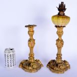 A PAIR OF 19TH CENTURY FRENCH ORMOLU CANDLESTICKS one with glass fittings. 39 cm high.