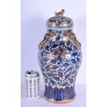 A LARGE 19TH CENTURY CHINESE BLUE AND WHITE PORCELAIN VASE AND COVER Qing, painted with flowers and