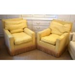 A PAIR OF DEEP COUNTRY HOUSE STYLE YELLOW ARM CHAIRS with associated gypsy table. (3)