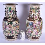 A LARGE PAIR OF 19TH CENTURY CHINESE CRACKLE GLAZED FAMILLE ROSE VASES Qing, painted with warriors i
