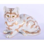A 19TH CENTURY JAPANESE MEIJI PERIOD AO KUTANI PORCELAIN FIGURE OF A CAT modelled with pink lashes.