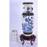 A 19TH CENTURY CHINESE BLUE AND WHITE CRACKLE GLAZED VASE Qing, together with a hardwood stand. Vase