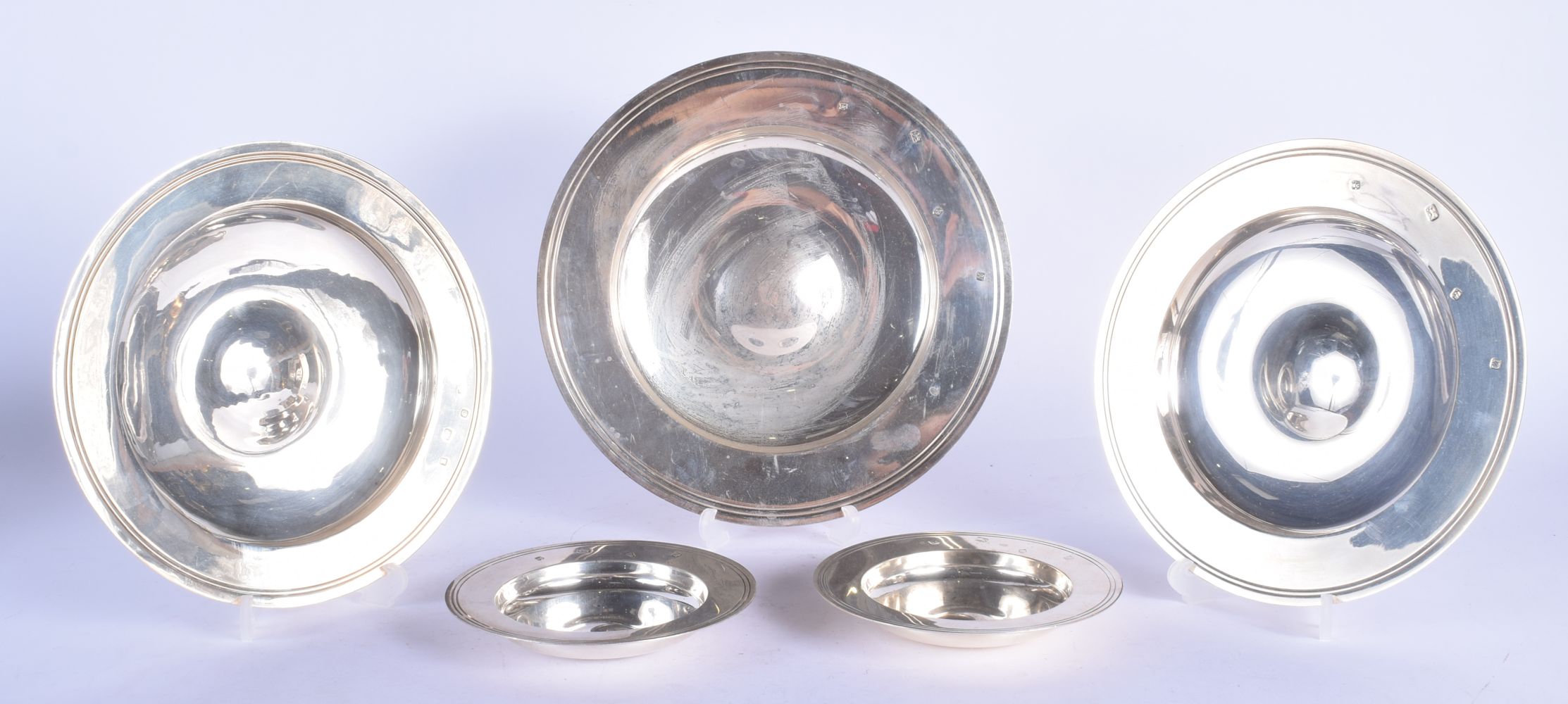 FIVE SILVER ARMADA DISHES. London 1986, 1987 & 2002. 2126 grams. Largest 25 cm diameter. (5)