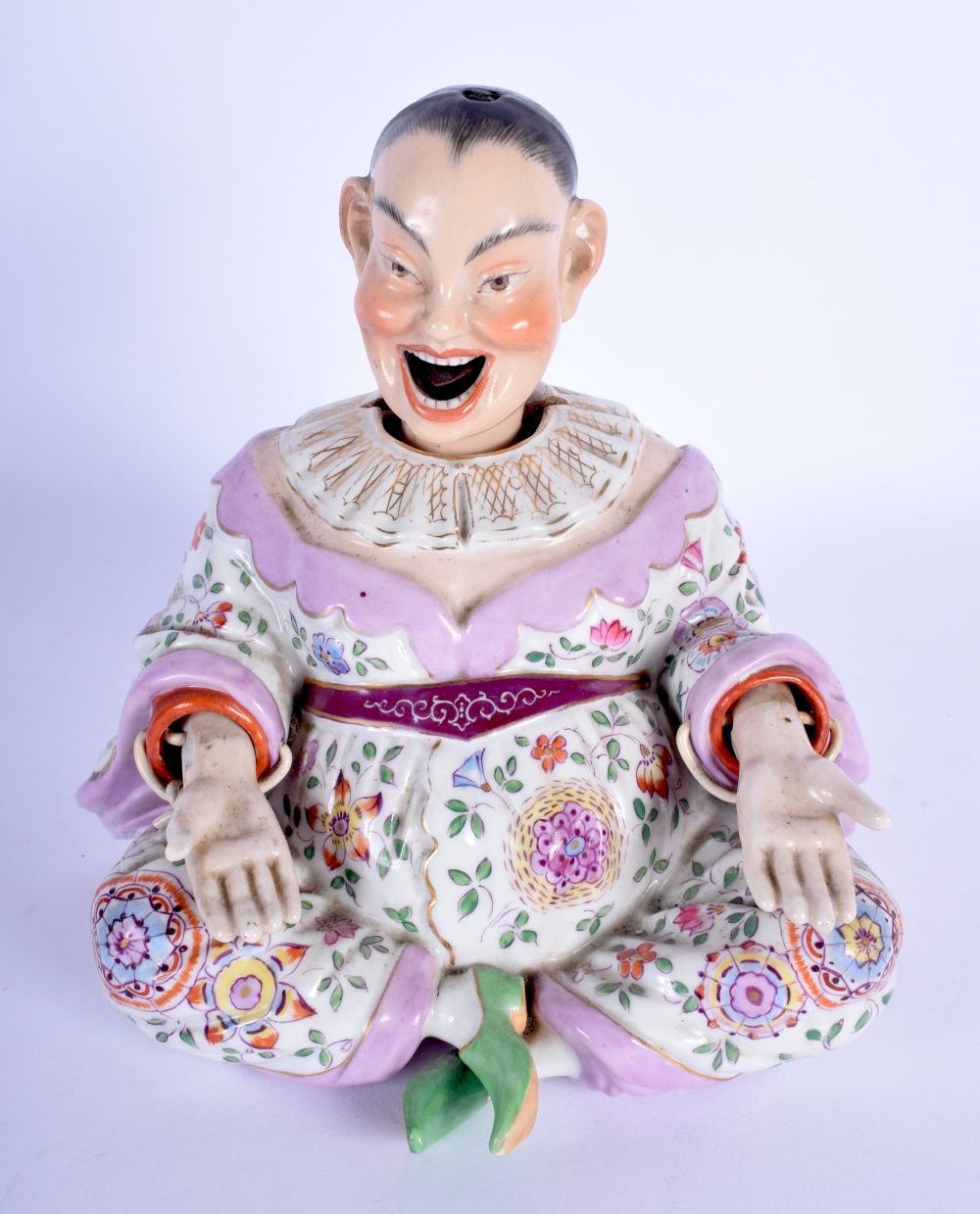 A 19TH CENTURY DRESDEN PORCELAIN NODDING FIGURE OF A CHINAMAN Meissen style, painted with flowers an
