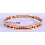 A 9CT GOLD BANGLE. 9 grams. 6.5 cm x 5.5 cm.