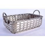 AN EARLY 20TH CENTURY CONTINENTAL TWIN HANDLED WHITE METAL BASKET of wicker type form. 40 cm x 26 cm