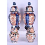 TWO PAIRS OF 19TH CENTURY IMARI VASES AND COVERS. Largest 28 cm high. (4)