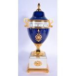 AN HOUR LAVIGNE FRENCH IMITATION LAPIS LAZULI REVOLVING DESK CLOCK with gilt metal overlaid marble b