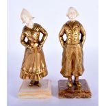 European School (C1910) Pair, Gilt bronze and ivory, Hands in pockets, onyx bases. 17 cm high.