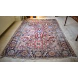 AN ANTIQUE MIDDLE EASTERN CARPET decorated with flowers. 290 cm x 200 cm.