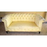 A GOOD QUALITY YELLOW GROUND UPHOLSTERED THEE SEATER SOFA. 150 cm x 65 cm.