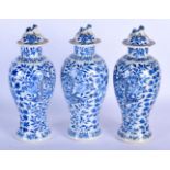 THREE LATE 19TH CENTURY CHINESE BLUE AND WHITE VASES AND COVERS bearing Kangxi marks to base. 28 cm