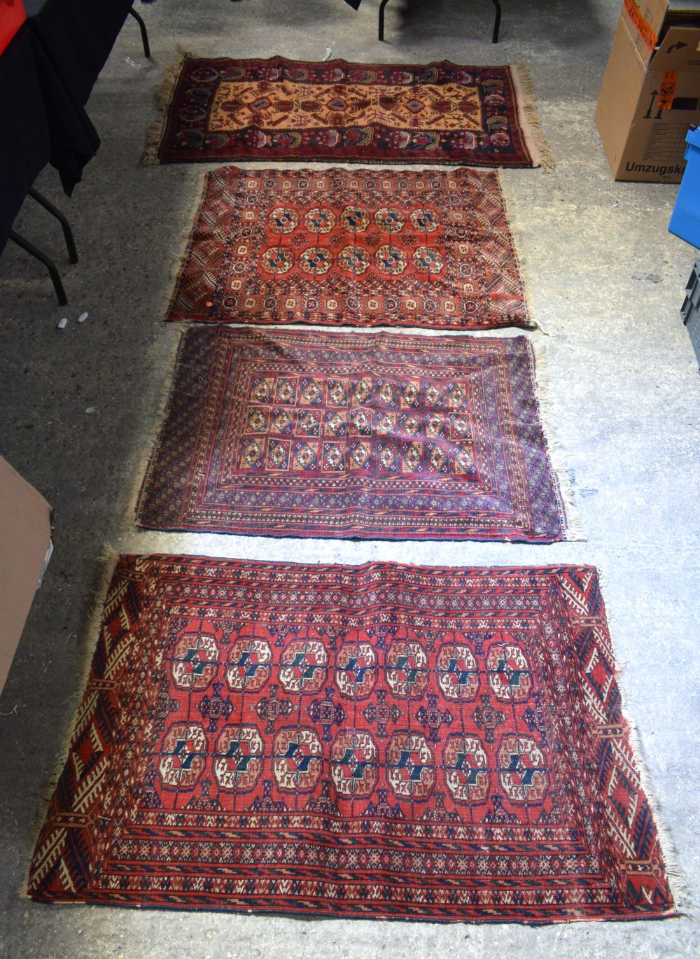 FOUR VINTAGE RUGS in various forms and sizes. (4)