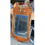 A GEORGE II WALNUT MIRROR with scrolling giltwood terminal. 124 cm x 67 cm.