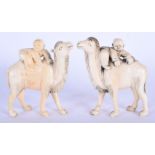 A PAIR OF LATE 19TH CENTURY CHINESE CARVED IVORY FIGURES OF CAMELS modelled with young attendants. 9