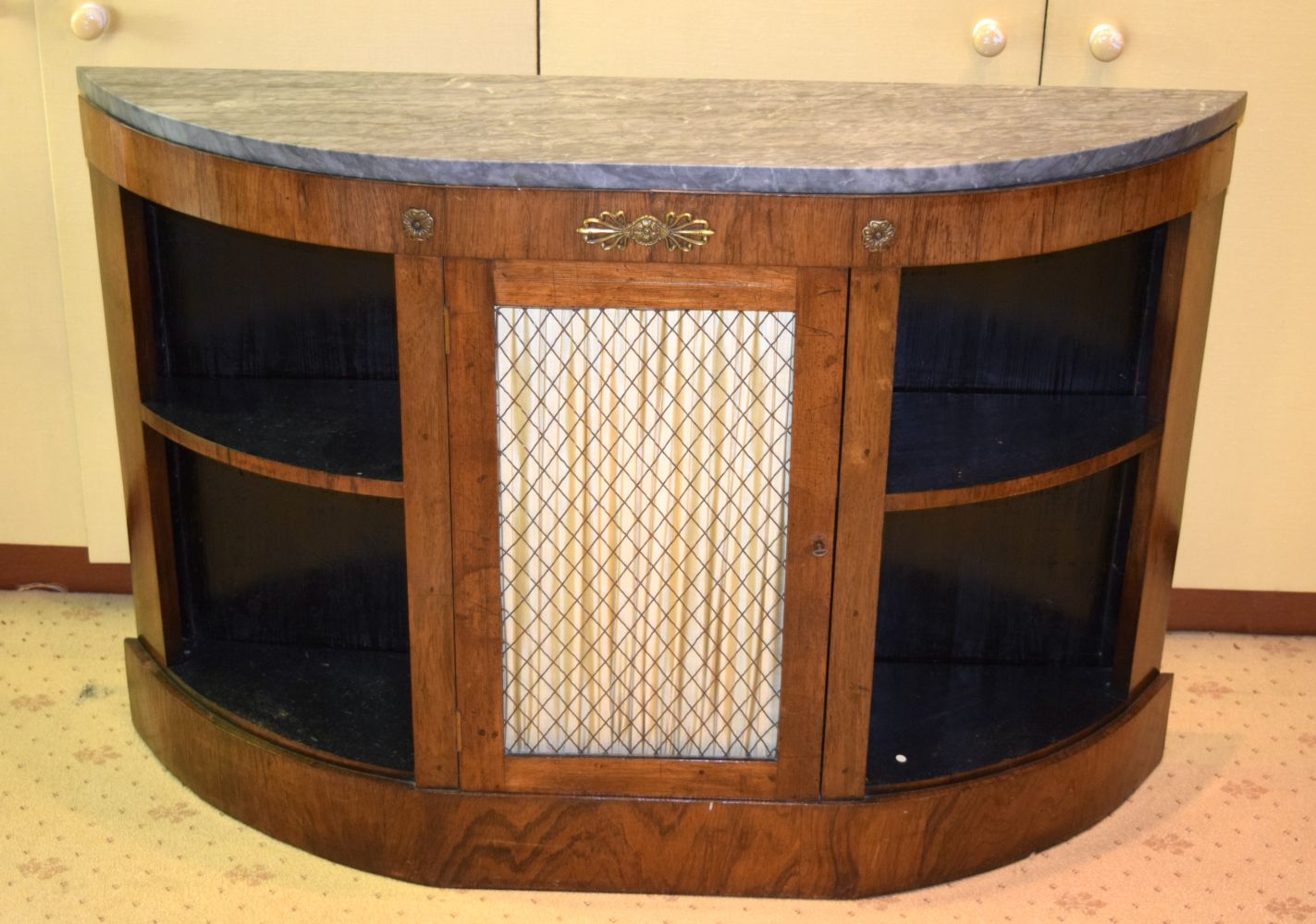 A REGENCY ROSEWOOD BOW FRONTED SIDEBOARD with marble top and floral capped mounts. 112 cm x 83 cm.