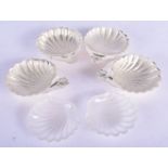 FOUR 1960S SILVER SHELL BUTTER DISHES. Birmingham 1966. Silver 189 grams. 10 cm x 2.5 cm. (4)