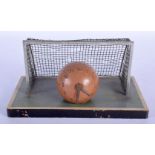 A VERY RARE 1950S PAINTED SPELTER FOOTBALL AND NET DESK CLOCK upon a painted wood base. 22 cm x 14 c