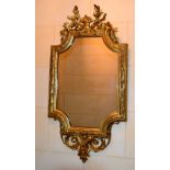 A GOOD LARGE 19TH CENTURY CONTINENTAL CARVED WOOD MIRROR of scrolling form. 105 cm x 55 cm