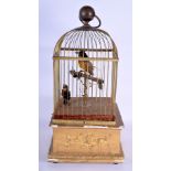 A MID 19TH CENTURY EUROPEAN CARVED GILTWOOD AUTOMATON SINGING BIRD CAGE embellished with flowers and