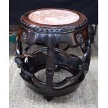 A 19TH CENTURY CHINESE HONGMU MARBLE INSET BARREL FORM STAND Qing, with dimpled decoration. 50 cm x
