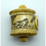 A small bone tape measure decorated with cats 5.5 cm.