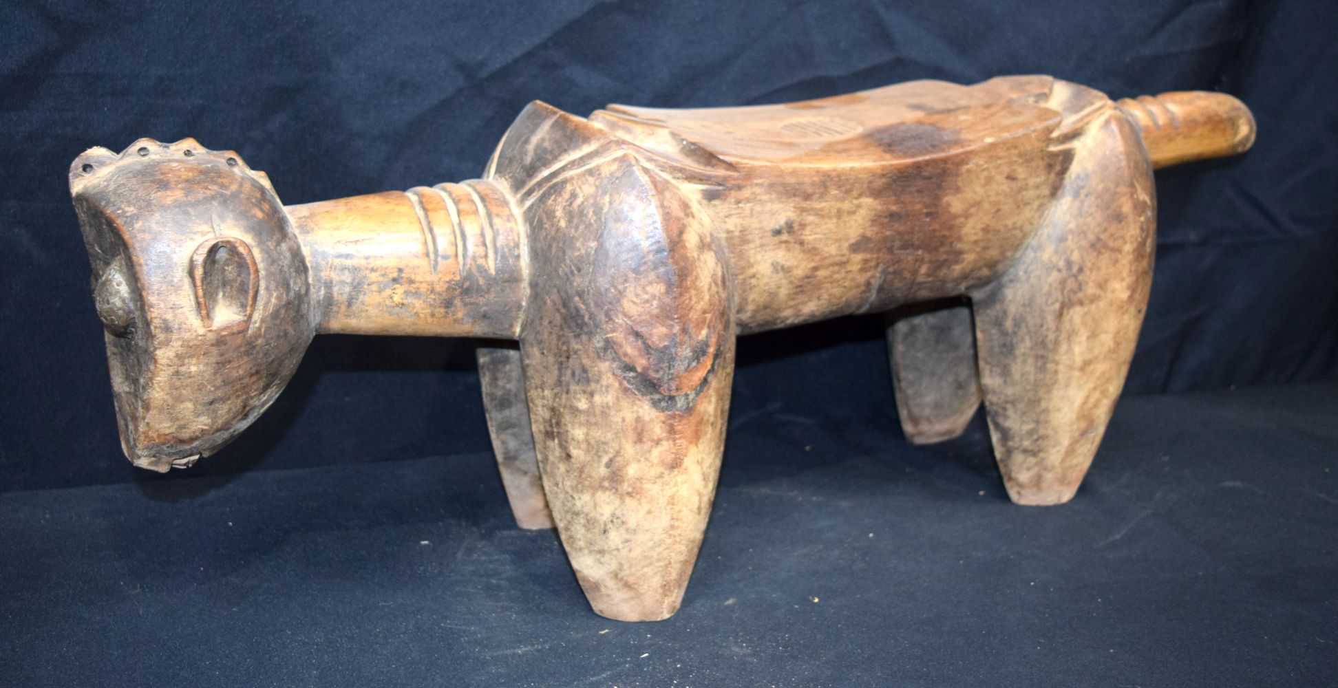 An African tribal Senufo Royal Tchon stool. 27 x 77cm