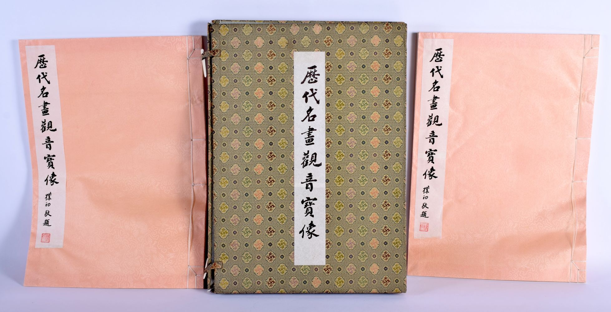 A CHINESE PAINTING AND WATERCOLOUR REFERENCE BOOK with silk binding. 40 cm x 30 cm.