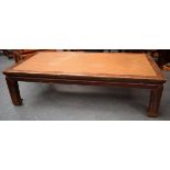 A 19th century Chinese elm framed opium bed, with rattan inset.
