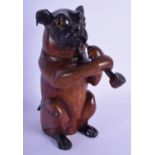 A 19TH CENTURY BAVARIAN BLACK FOREST CARVED WOOD TOBACCO JAR AND COVER modelled as a hound smoking.