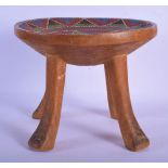 AN EARLY 20TH CENTURY AFRICAN TRIBAL BEAD INSET KENYAN STOOL with splayed legs. 24 cm x 22 cm.