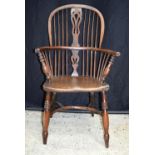 A 19th century wooden Windsor chair. 101 x 60cm