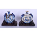 A PAIR OF 19TH CENTURY FAIENCE TIN GLAZED POTTERY VASES painted with hunting scenes and deer. 12 cm