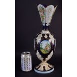 A 19TH CENTURY BOHEMIAN ENAMELLED GLASS VASE painted with landscapes. 42 cm high.