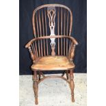 A Nicholson Rockley high back wooden Windsor chair. 117 x 62cm