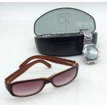 A vintage Calvin Klein cased sunglasses together with a Michael Korrs men's wristwatch (2)