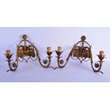 A PAIR OF EARLY 20TH CENTURY BRASS TWIN WALL SCONCES decorated with floral roundels. 42 cm x 34 cm.