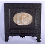 A LARGE 19TH CENTURY INDIAN PAINTED IVORY MINIATURE within a large ebonised frame. 26 cm x 26 cm.