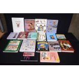 A collection of antiques reference books and a playmates book (17).