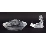 A FRENCH LALIQUE GLASS LION ASHTRAY together with a Lalique scorpion. Largest 14 cm x 14 cm. (2)