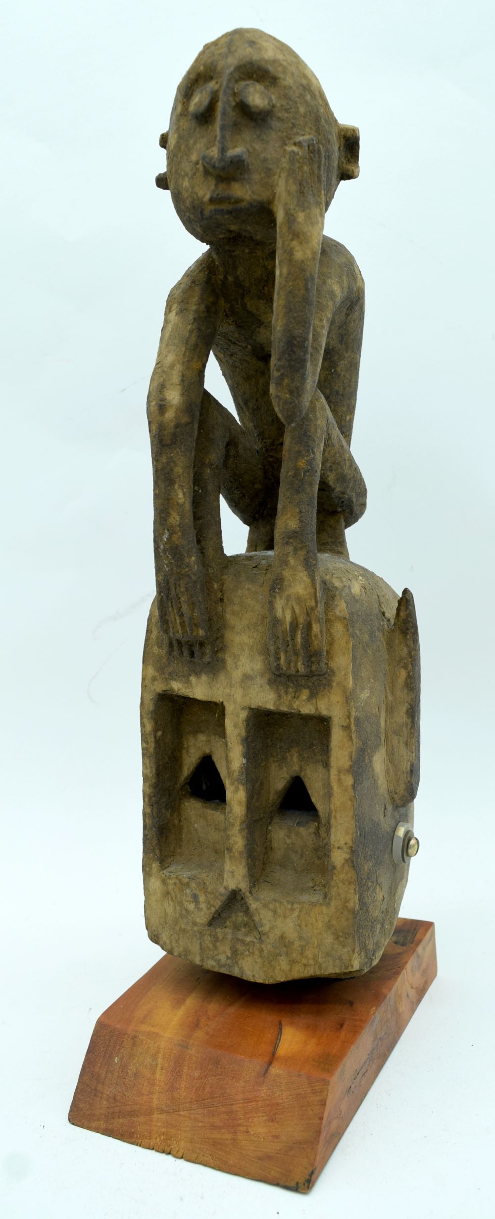 An African tribal Dogon Omino Mask set on a stand. 35cm