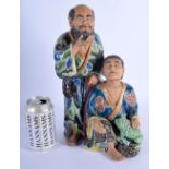 A LARGE 19TH CENTURY JAPANESE MEIJI PERIOD AO KUTANI FIGURE OF TWO SCHOLARS painted with flowers hol